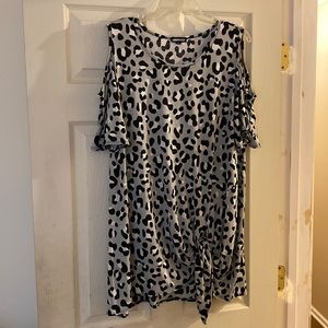 Leopard print, cold shoulder top.  Ties an the hip.  Longer tunic length. 1X.
